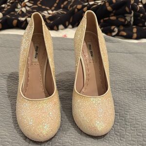 Miu Miu glitter shoes.